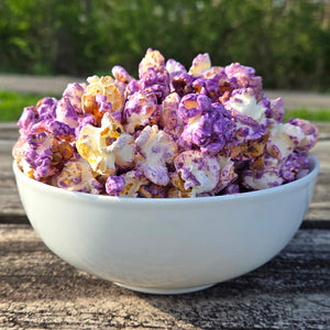Bowl of blueberry lemon pound cake popcorn sitting on a table.