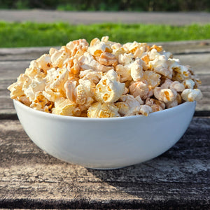 White bowl filled with peppermint hot chocolate flavored popcorn.