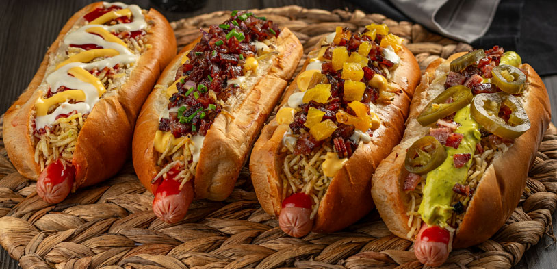 hot dogs with varying toppings like cheese, jalapenos, etc.