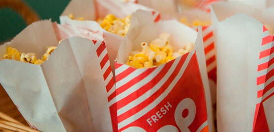 white and red bags of yellow popcorn.