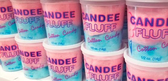pink and blue cotton candy inside of pre packaged plastic containers.