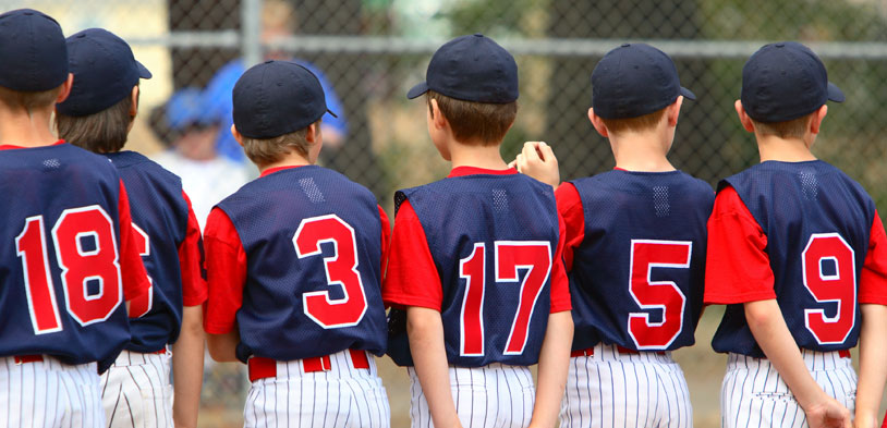 youth sports team wearing jersies with player number facing camera