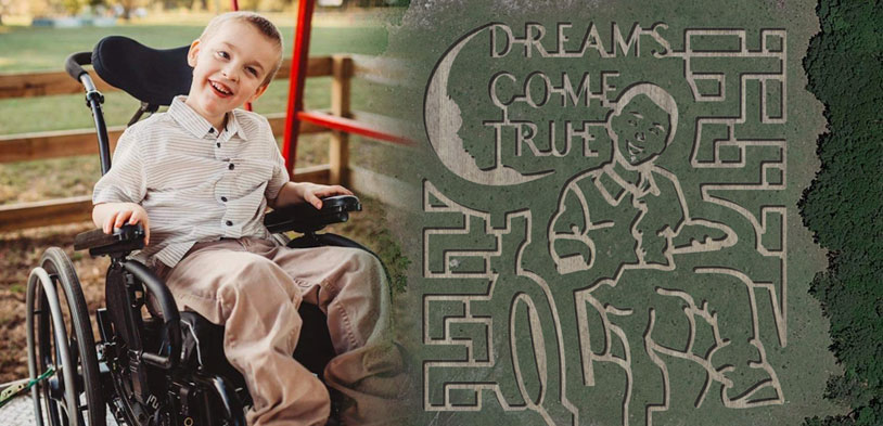A child in a wheelchair outside side by side his cutout in a corn maze viewed from far above.