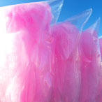 Pink cotton candy in bags on a sunny day