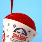 Snow Cone with red syrup on a blue background