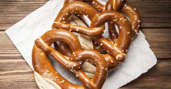 a couple pretzels laying on napkins