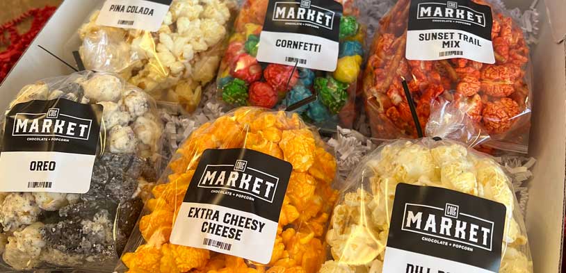 Variety Box of Cole Market popcorn bagged and labeled.