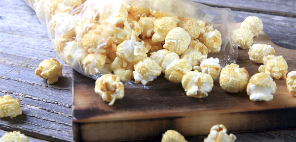 a bag of kettle corn spilling out of bag.