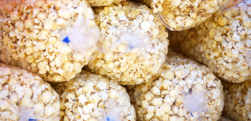 Kettle Corn bags stacked upon each other.