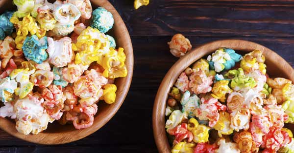 Rainbow Popcorn in two wooden bowls on a table