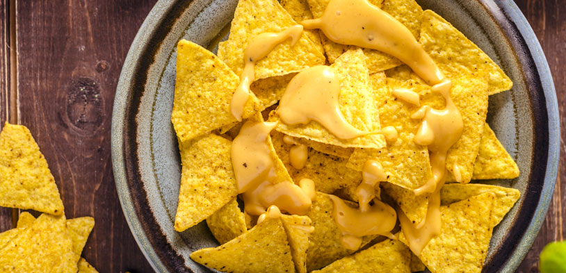 plate of nachos with melted cheese