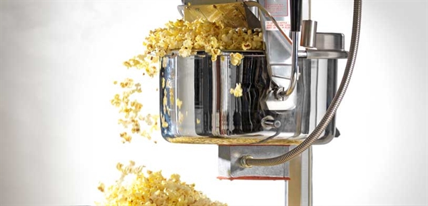 Popcorn cooker pops and some escapes out of it.
