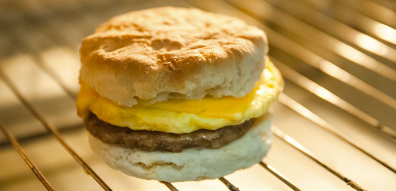 brekafast sandwich sitting on hot grate