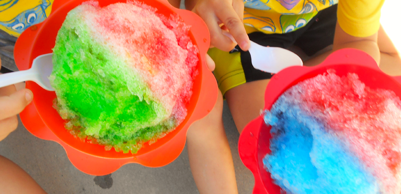 A top down view looking down on two snow cones in cups