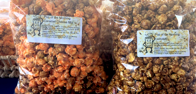 bags of cheese and caramel corn sitting on a table
