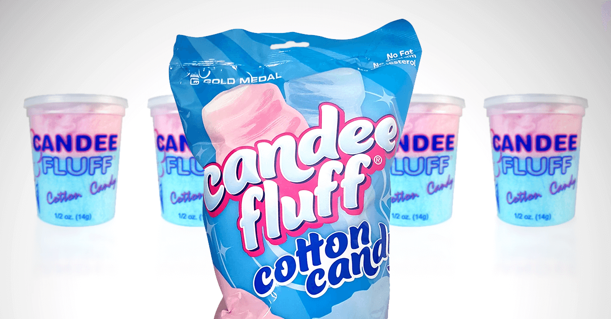 lineup of pink and blue mix Candee Fluff cotton candy containers in background with prepacked Candee Fluff bag cotton candy in foreground lineup of pink and blue mix Candee Fluff cotton candy containers in background with prepacked Candee Fluff bag cotton candy in foreground