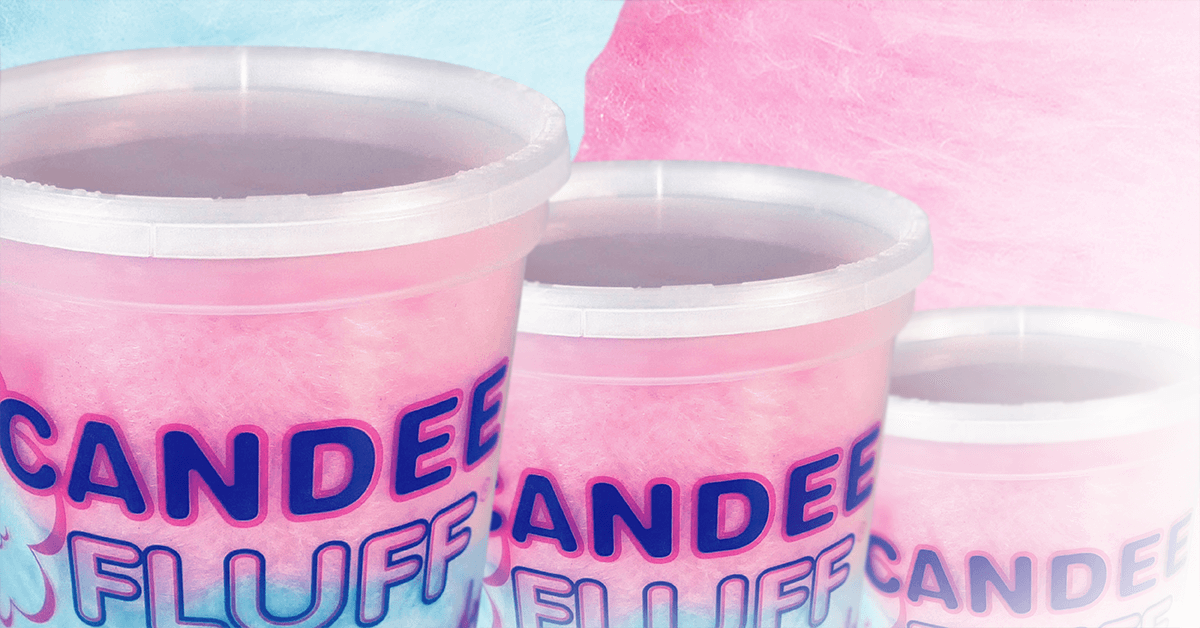 rows of pink and blue cotton candy in Candee Fluff plastic sealed containers