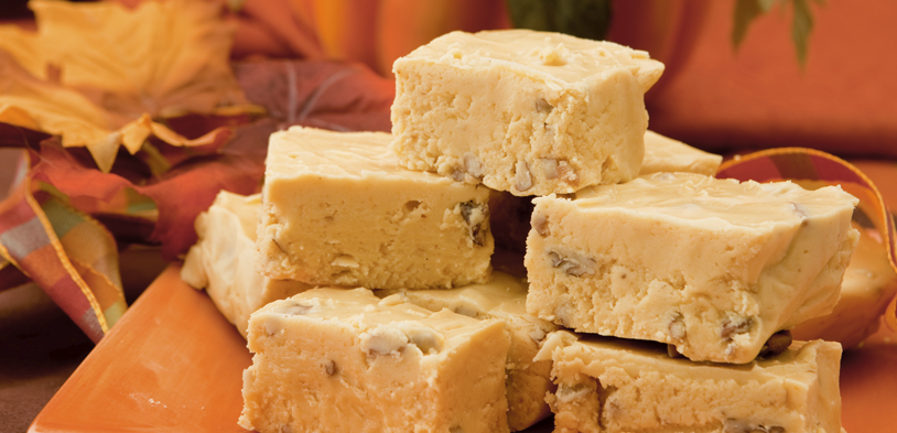pumpkin fudge stacked on a plate