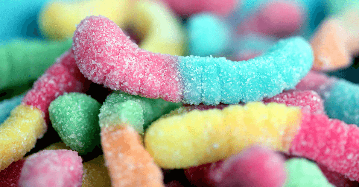 close-up of colorful sugar-coated gummy worms close-up of colorful sugar-coated gummy worms