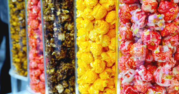tubes of different flavors of gourmet popcorn.