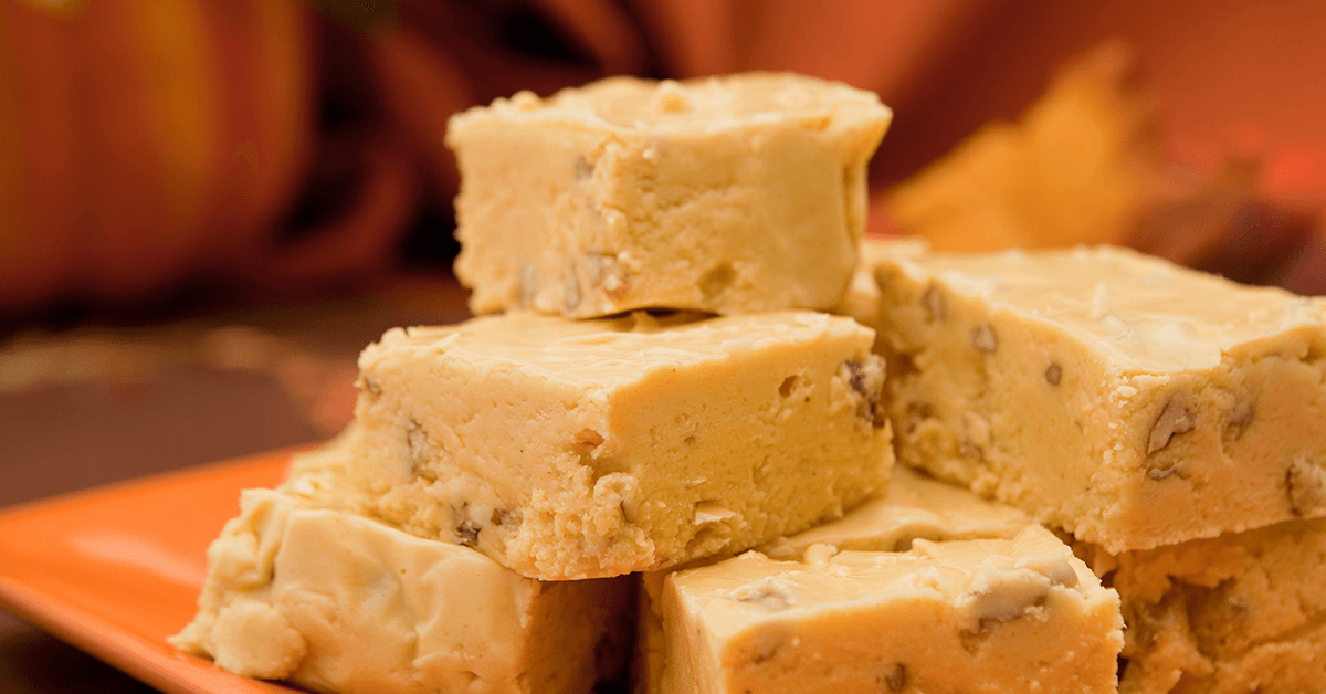 squares of praline pumpkin spice fudge with autumn background colors