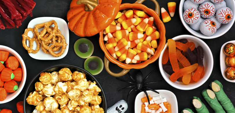 halloween treats on a black table with a view from the top